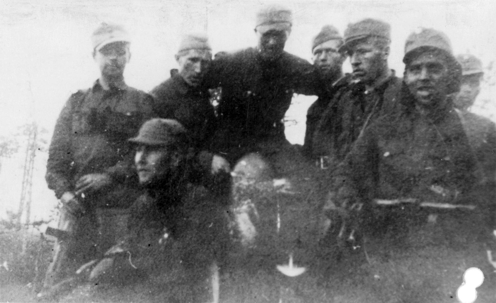 July 8, 1941. Tolvanen group after delivering of supplies by plane. Sitting: Arvo Pikkanen; standing: Antti Porvali, Mauri Kärpänen, Ilmari Tolvanen, Eugen Wist, Juho Honkanen, Toivo Paavilainen and Muisto Lassila