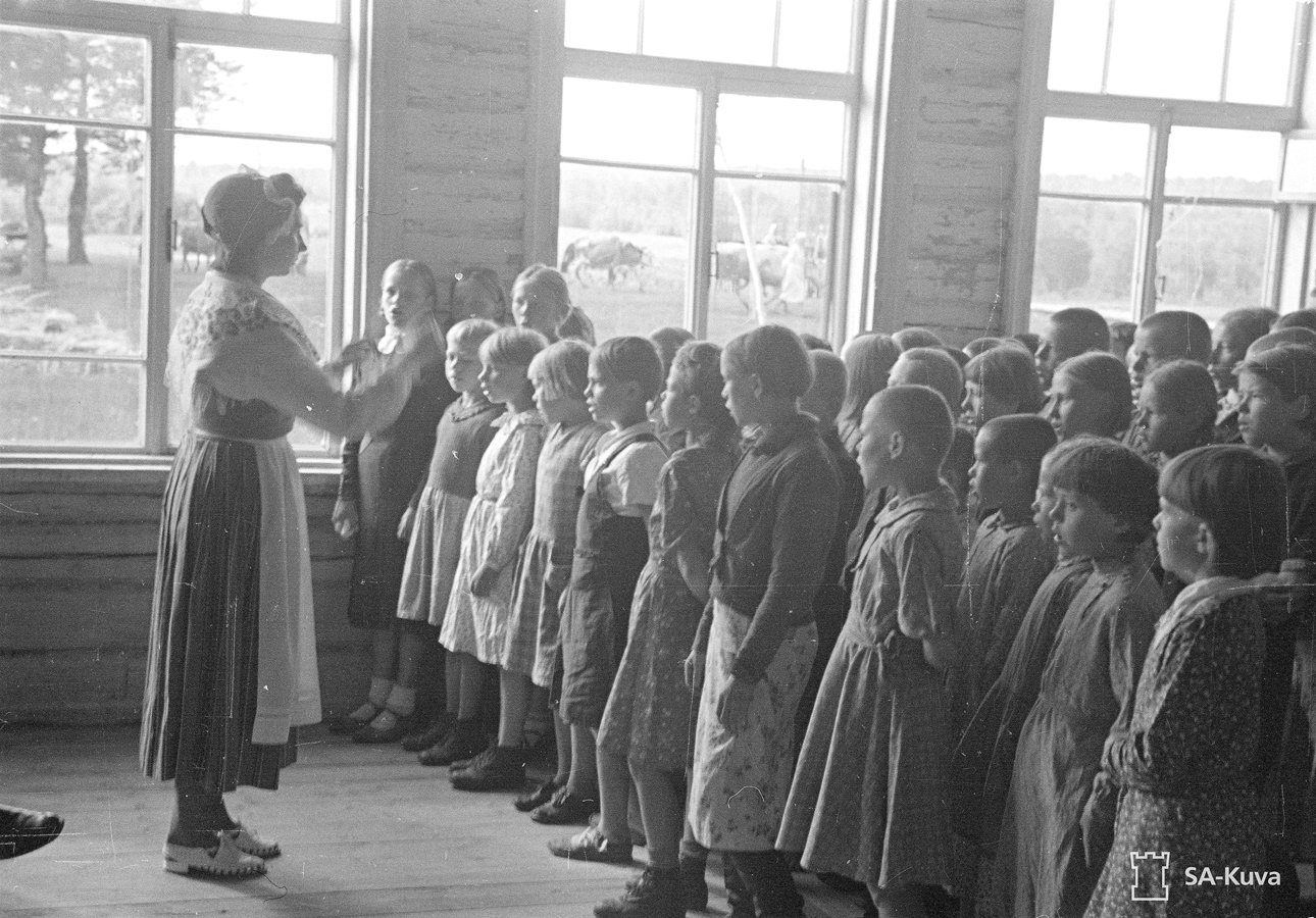 July 15, 1942. Students of the Popular School singing